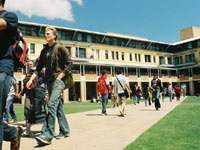 students in the quad building